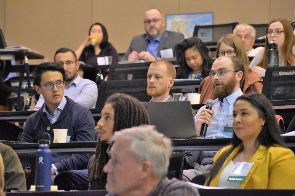 Attendees listen to a speaker at a Water 101 Workshop.